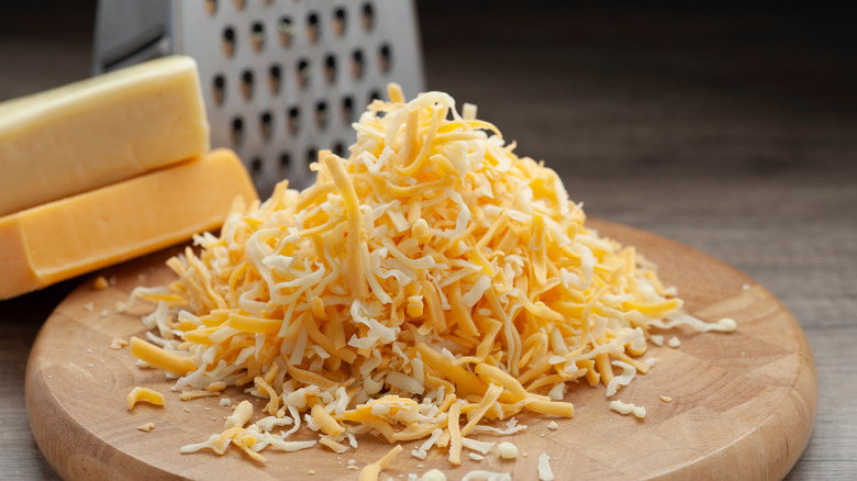 cheese block grater and shredded cheese