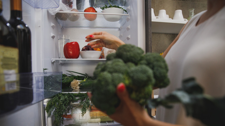 Home cook organizing a fridge