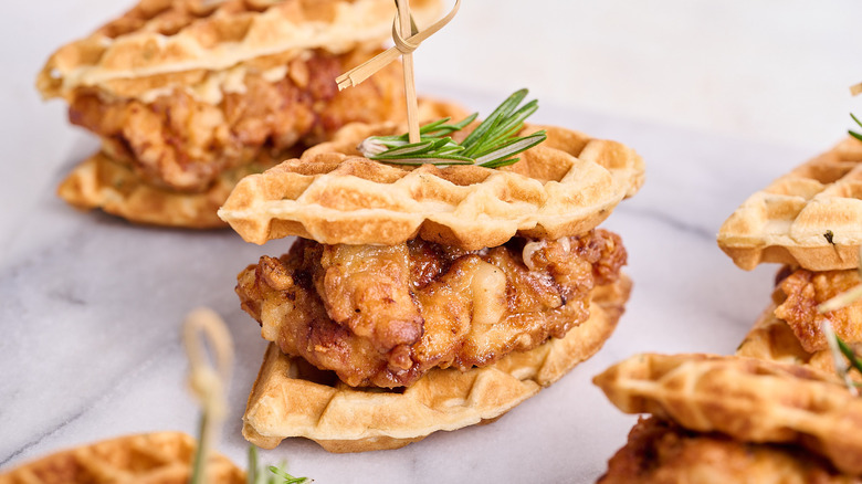 chicken and waffle sandwich on table