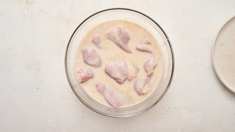 chicken soaking in buttermilk