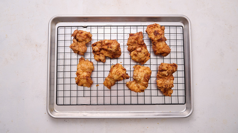 draining chicken on sheet tray