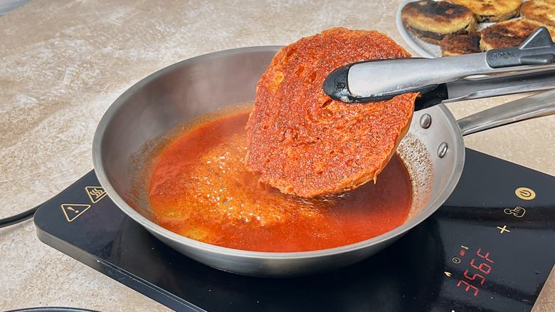 cooking soaked bread in skillet