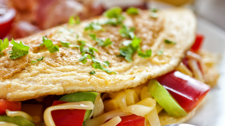 omelette taco with peppers, onions, and cheese