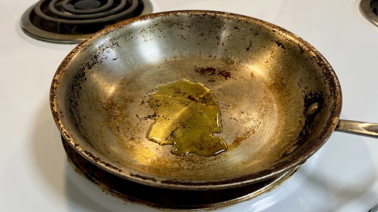 a stainless steel skillet with olive oil