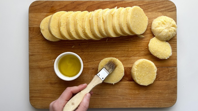 sliced polenta brushed with olive oil