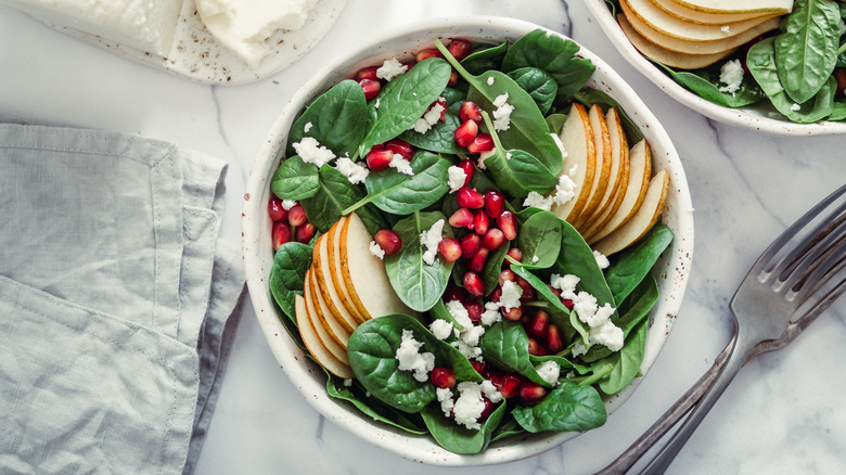 Spinach, pear, and pomegranate salad