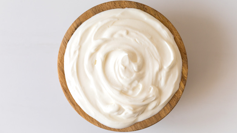 White cream in wood bowl