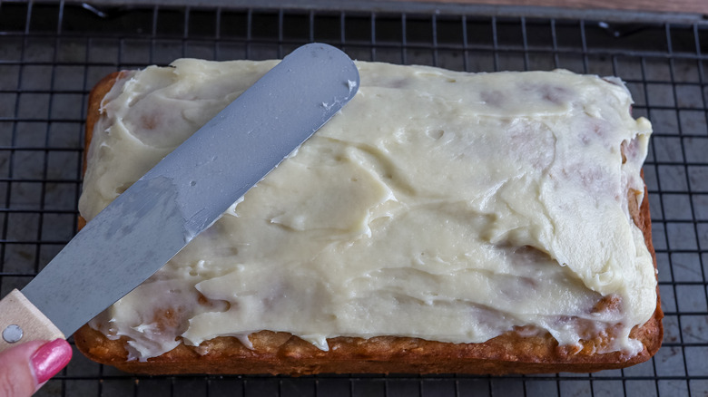 frosting being spread on bread