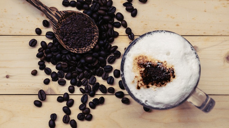 Frothy coffee with coffee beans