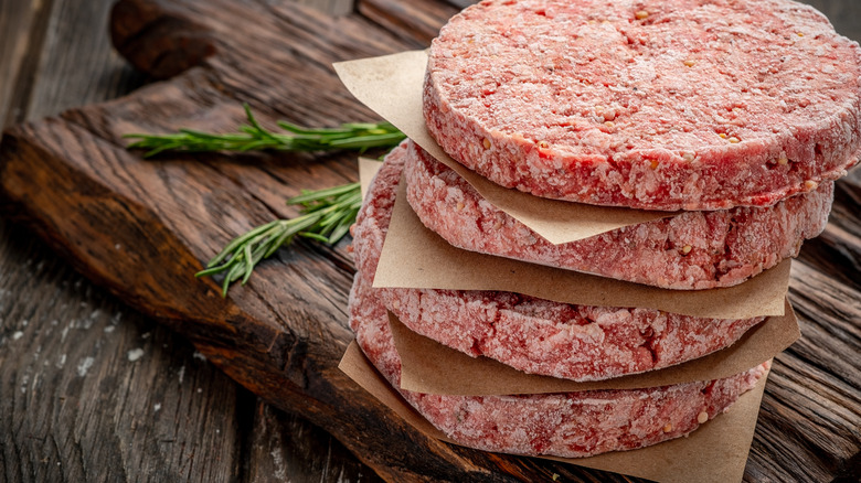 Stack of frozen burger patties