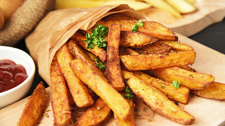 Seasoned french fries with ketchup