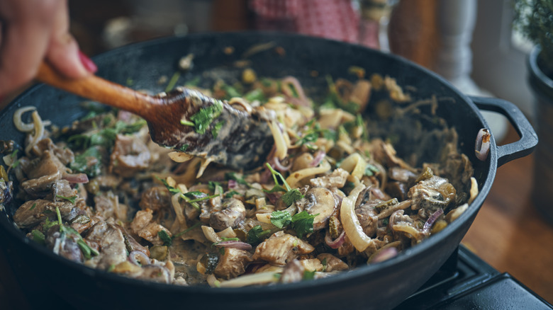 mushrooms cooking in pan