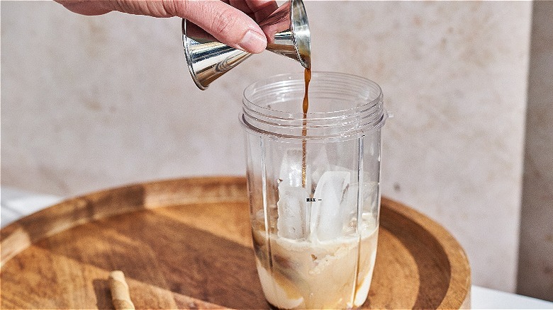 pouring coffee liqueur into blender