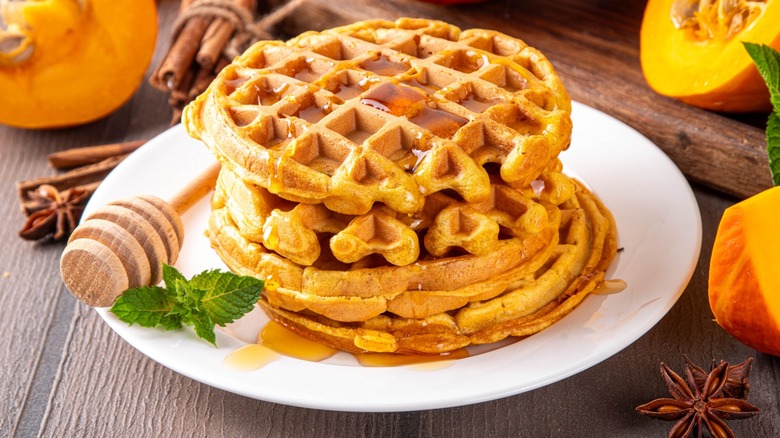 A stack of waffles on a plate