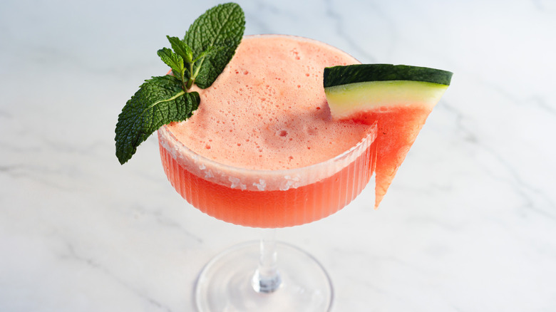 Watermelon margarita glass with garnishes