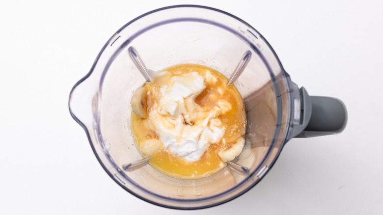 orange smoothie ingredients in blender