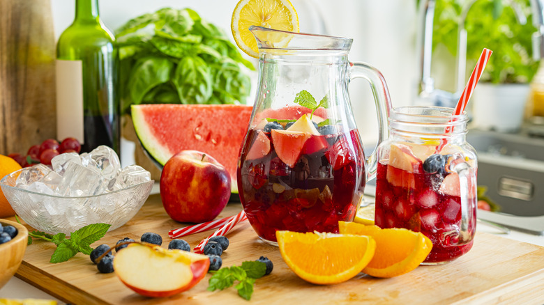 A pitcher of sangria and ingredients