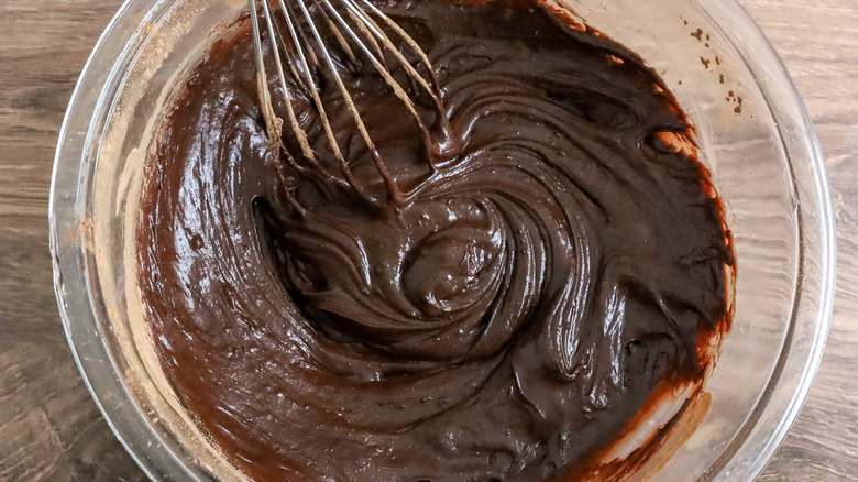 whisking chocolate batter in bowl