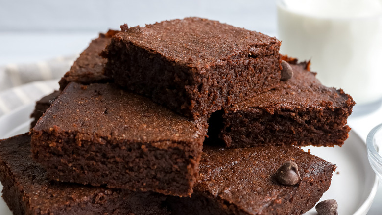 fudgy keto brownies stacked on plate