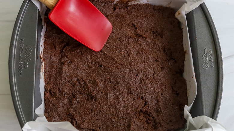 brownie batter spread into a pan