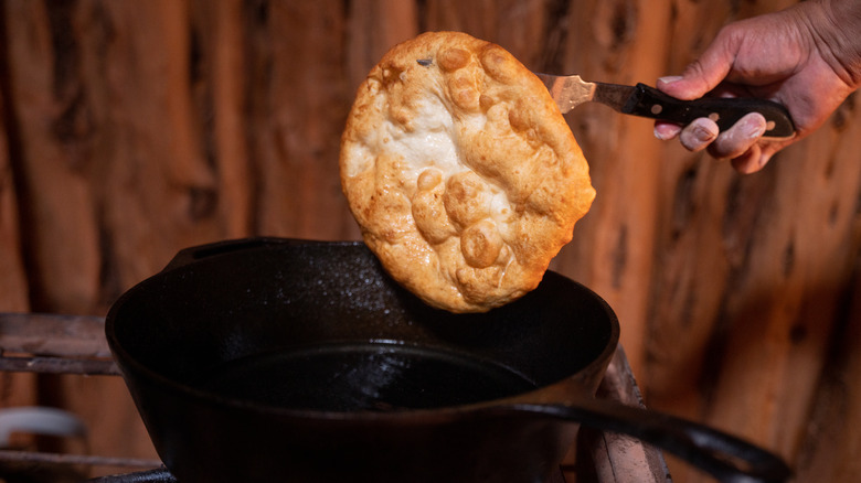 Hand cooking traditional Navajo fry bread