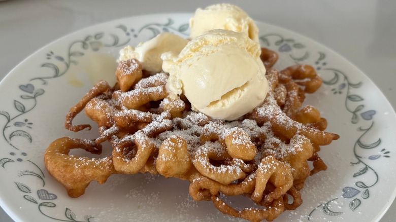 Homemade funnel cake with vanilla ice cream