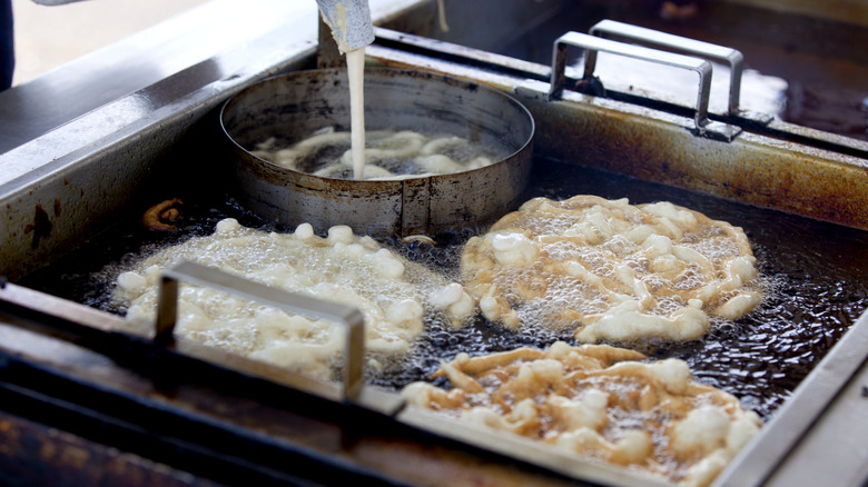 Batter is poured into oil