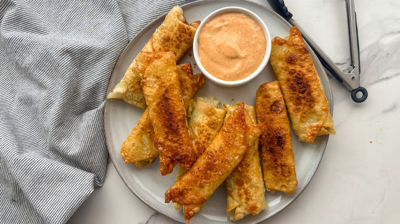 eggrolls and sauce on plate