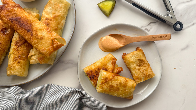 eggrolls on plate with sauce