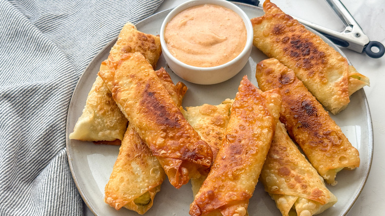 eggrolls and sauce on plate