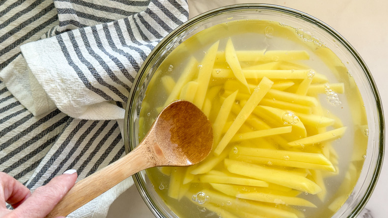 potatoes in bowl of water