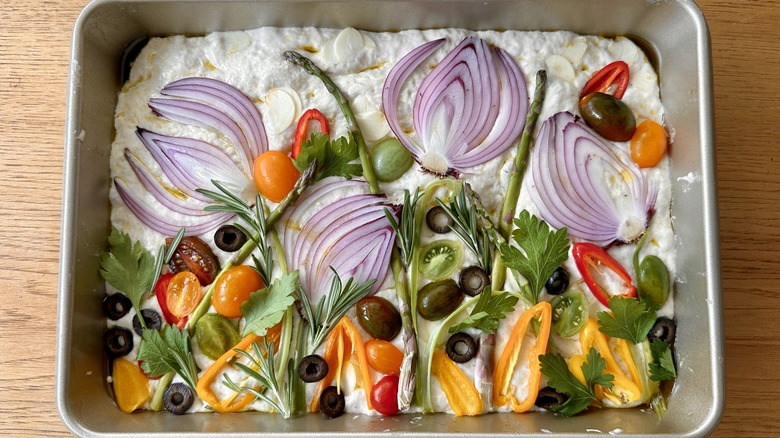 Vegetable-topped focaccia dough