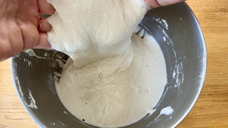 Stretching focaccia dough