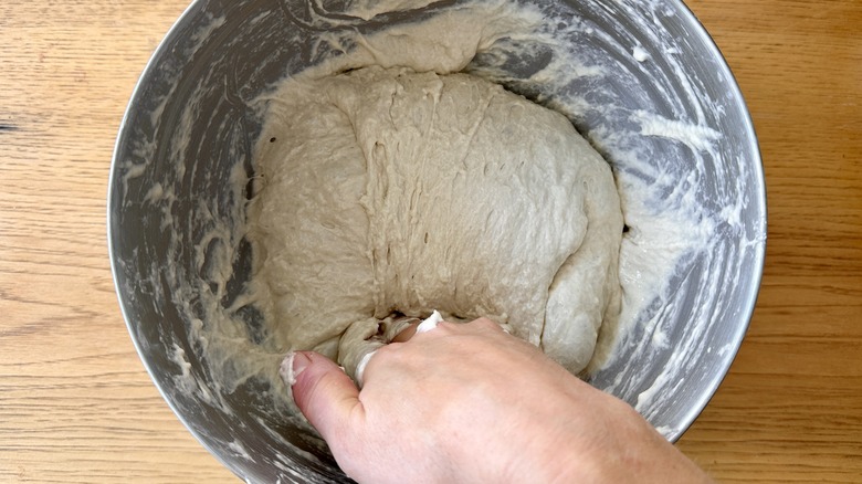 Folding focaccia dough