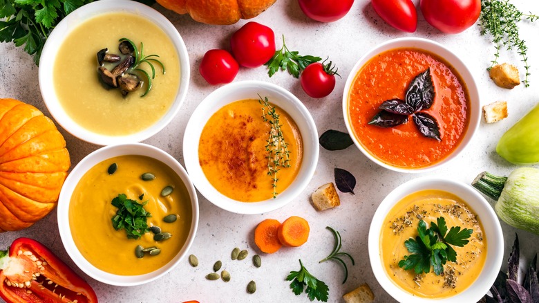 Colorful soups in bowls