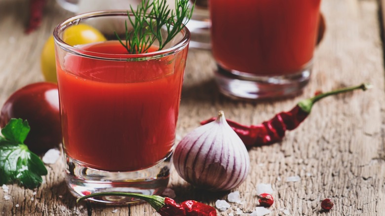 A Bloody Mary cocktail and garlic head