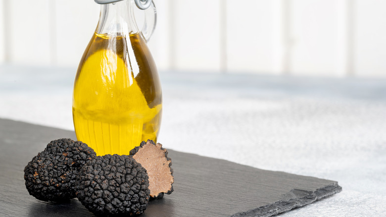 truffles next to bottle of olive oil