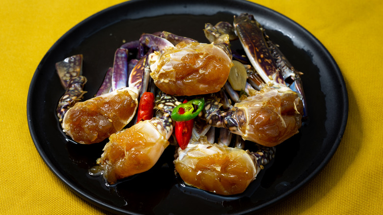 marinated crabs served on plate