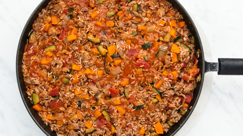 veggies and rice in pan