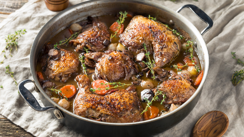 Homemade French coq au vin with vegetables and sauce