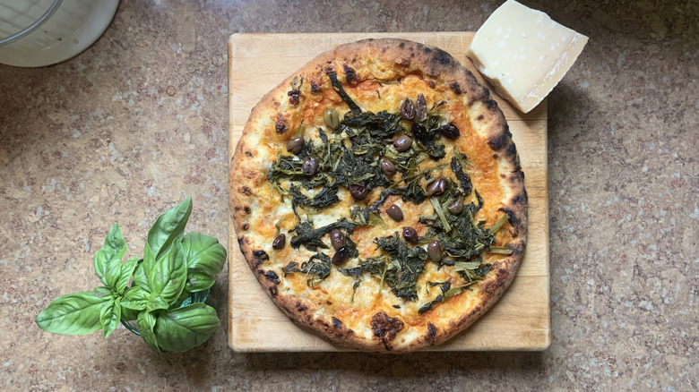 Pizza with leaves and olives