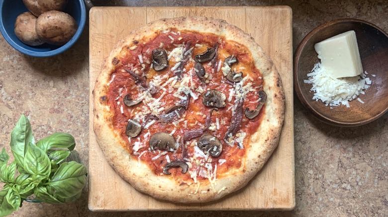 Pizza with mushrooms and anchovy