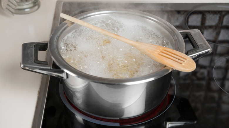 wooden spoon over boiling water