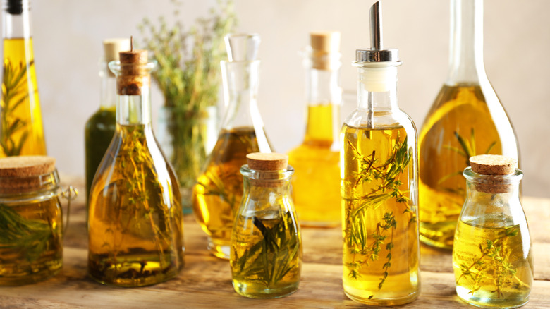 Bottles of olive oil infused with herbs