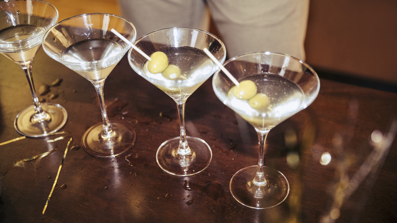 Line of martini glasses on table