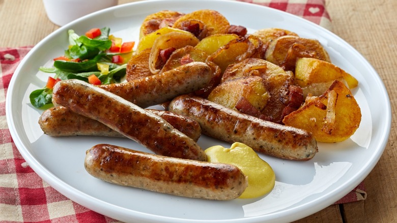 Bratkartoffeln and sausages on plate