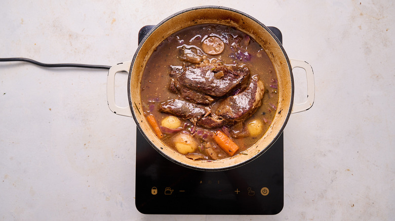 beef in pot with potatoes and vegetables