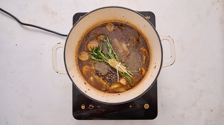 broth and seasonings in pot