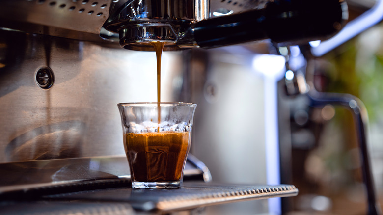 Espresso pouring into shot glass