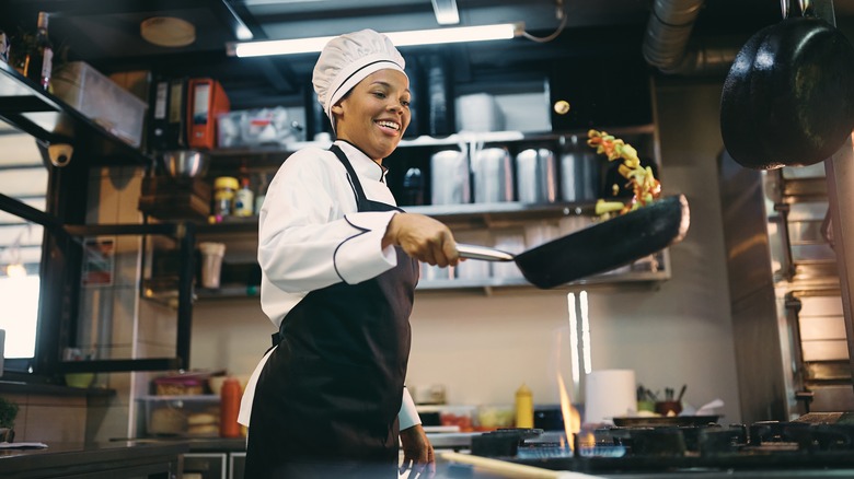 Female chef in commercial kitchen 